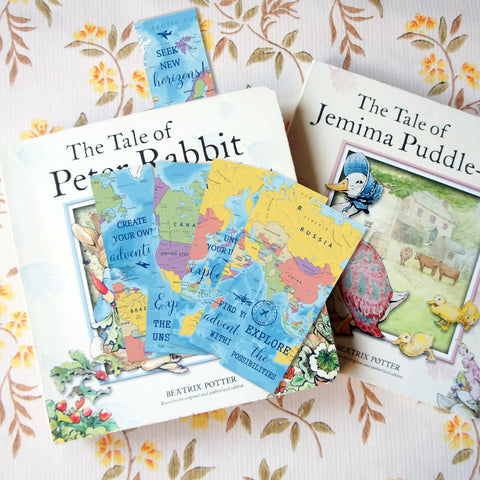 World Map Bookmarks Bulk Set 200 Pcs For Reading Goals And Classroom Decor with books in background on floral surface
