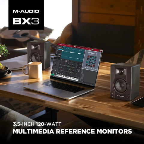 Pro Grade Wired Studio Monitors For PC With Three Point Five Inch Drivers Latency Free Audio next to a laptop on a desk