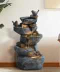 5 Tier Cascading Rock Water Fountain With LED Lights For Outdoor And Indoor Use, resin water feature in living room setting