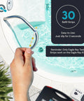 Hand using Digital Spa Water Test Kit with Digital Water Tester and 30 Hot Tub Test Strips for chlorine and pH testing.