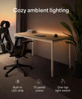 Rock Solid Electric Standing Desk Gliding Smoothly On Ultra Quiet Quad Motors Sixty Three Inch Worktop with LED ambient lighting.