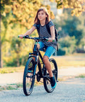 Teenager riding a bike with Two Pack 24 Inch Heavy Duty Bike Tubes 45/57-507 With AV32mm Schrader Valve Fits 24x1.75 To 24x2.25