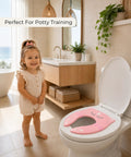 Foldable Travel Potty Seat For Toddlers Featuring A No Pinch Silicone Grip And Slick Non Slip Base Comes With A Pink Unicorn Bag, child using it in a modern bathroom.