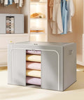 Front view of Foldable Metal Frame Storage Bins Set For Clothes And No Fuss Organization, 100L Each, 3 Pack, in a closet.