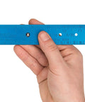 Close-up of hand holding Spoke Bearing And Cotter Gauge For Bicycles, Handy Wheel Maintenance Tool with easy-to-read scale.