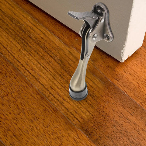 Kickdown Door Stopper For Commercial And Garage Doors Dope Heavy-Duty Zinc Alloy Build With Foot-Operated Design in use