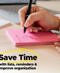 Close-up of hand writing on pink Two Times The Stickiness Eight 6 By 4 Inch Sticky Note Pads With 45 Sheets Each Energy Boost Collection.