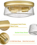 Close-up of 12 Inch 2-Light Modern Gold Flush Mount Ceiling Light with Seeded Glass, showing champagne gold finish and bulb base