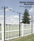 Outdoor String Light Poles 2 Pack 8.5 Ft Heavy Duty Metal Posts With 5 Prong Base And Spiral Ground Anchor For A Stable Backyard Garden Patio Christmas Lighting No Fuss Setup displayed with lights on fence