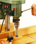 Top Shelf 18 Piece Forstner Bit Set 15 To 40 Mm Carbide Tipped Round Shank Wood Drill Bits With Heavy Duty Case in use on a drill press.