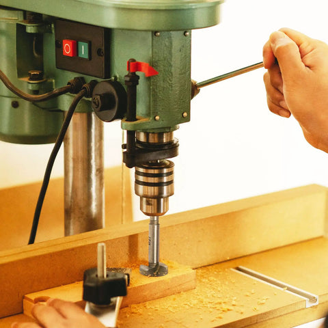 Top Shelf 18 Piece Forstner Bit Set 15 To 40 Mm Carbide Tipped Round Shank Wood Drill Bits With Heavy Duty Case in use on a drill press.