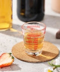 Two Pack Shot Glass Measuring Cup Set With Thick Base, Multi Unit Liquid Measuring Cup For Espresso And Drinks, Four Measuring Scales Include 1 OZ, 2 TBS, 6 TSP, 30 ML For Precise Pouring on table