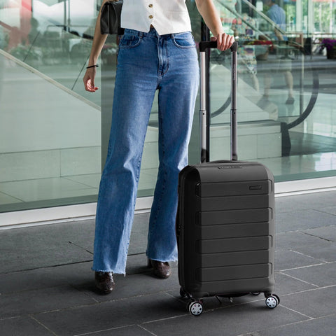 Front view of black Traveler's Choice Pagosa 22-inch hardside carry-on with spinner wheels and extended handle.
