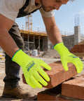 Man wearing Heavy Duty Micro Foam Nitrile Work Gloves With Hella Breathable 15 Gauge Nylon Shell And Killer Tiger Stripe Grip For Auto Repair And Precision Mechanical Assembly Tasks Pack Of Three X Large while placing bricks at a construction site.