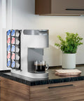 Side Mount K Cup Holder For Keurig Adhesive Metal Pod Organizer Matte Black Finish 2 Pack Keeps 10 K Cups Handy And Neat Space Saving Counter Mount For Keurig Coffee Makers attached to a coffee maker on a kitchen counter