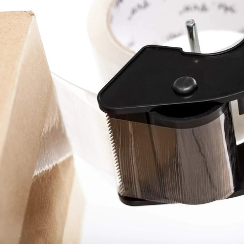 Clear Packing Tape For Shipping, Packing, Moving And Storage, 2 Inch Wide, 60 Yards, 1.9 Mil Thick, No Smell applied on cardboard