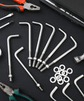 304 Stainless Steel J Bolts 3/8-16 X 6 Inches Set Of 10 Concrete Post Anchors with nuts and washers on a black surface with tools