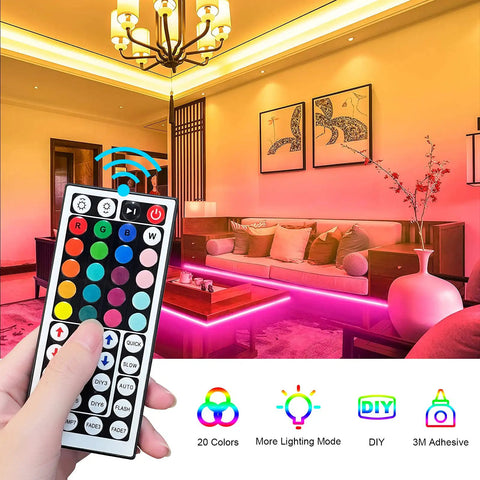 Hand holding remote for 32.8Ft RGB LED Strip Lights With 44 Key Remote Color Changing Mood Lighting To Set The Vibe