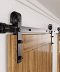 Black Rustic Non Bypass Sliding Barn Door Hardware Kit For Two Doors 9ft Flat Track With Classic Roller System, installed view
