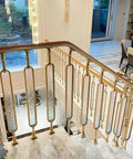 Heavy Duty Aluminum Stair Spindles With Smooth Colored Glass Panels Floor Mounted Deck And Porch Railings Set Of 10 37 Inch Tall weather resistant balusters in upscale interior setting.