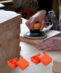 4 Piece Woodworking Ratchet Band Clamp Blocks Set For Secure Frame And Corner Assembly, shown near woodworking table.