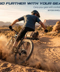 Cyclist using Adjustable Rear Bike Carrier Rack With 20Lb Capacity Universal Extendable Aluminum Cargo Rack on rugged terrain