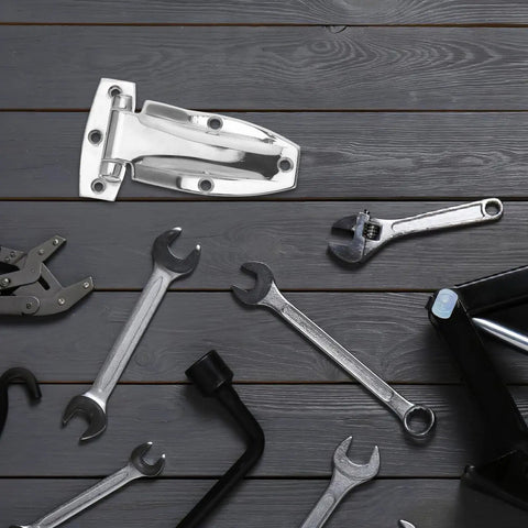Stainless Steel Side Door Truck Hinge For Box Trucks And Trailers, surrounded by wrenches, placed on wooden surface