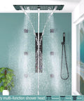 Premium Matte Black Shower Setup With A Heavy Rainfall Head And Adjustable Handheld Sprayer Dual Body Jets Plus Six Function Valve with cascading water.