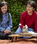 Children enjoying On The Go S'mores Portable Campfire Kit For Easy Outdoor Treats That Make S'mores A Breeze at a campsite.