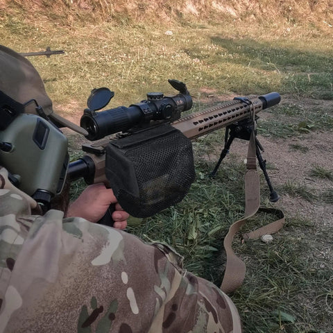 Rifle with Heat Resistant Brass Shell Catcher With Quick Release Zipper And Picatinny Rail Mount For Efficient Brass Collection.