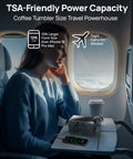 Woman using Portable Power Station 89.6Wh LiFePO4 Battery With Solar Ready 100W AC Outlets And USB C PD Fast Charging on airplane