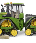 John Deere 9620RX Track Belts Tractor Toy Realistic 1 To 16 Scale German Made ABS Plastic Farm Vehicle on rocky surface