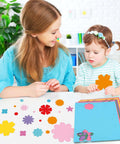 Child and adult crafting with 482 Piece DIY Flower Cutouts Set With Colorful 2 Sided Cardstock Flowers Die Cuts And Glue Points For Kids
