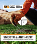 Gloved hand using 10-Pack 6-Inch Heavy Duty Landscape Staples Tough-As-Nails Rust-Proof Galvanized 11-Gauge U-Pins on grass