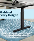 Vari ComfortEdge Electric Standing Desk 60X30 Black with 3-tier legs and a quiet motor in home office setting.