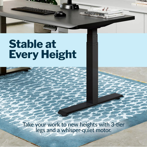 Vari ComfortEdge Electric Standing Desk 60X30 Black with 3-tier legs and a quiet motor in home office setting.