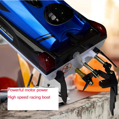 Beast 14 Inch RC Boat For Lakes And Pools with Dual 1100mAh Batteries, showing motor and rudders, speeds up to 25 kph