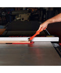 Get A Grip TPR Push Stick With Reversible Notches And Bright Orange Grip guiding wood on table saw