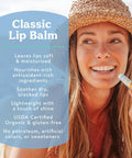 Woman holding a lip balm from Must Have Organic Lip Balm Gift Set Four Flavor Pack Featuring Tangerine Lavender Orange Vanilla Grapefruit