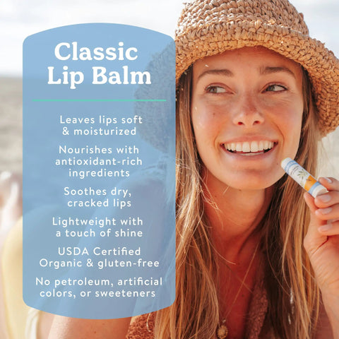 Woman holding a lip balm from Must Have Organic Lip Balm Gift Set Four Flavor Pack Featuring Tangerine Lavender Orange Vanilla Grapefruit