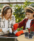 Two people gardening with Clear 4 Inch Nursery Pots With Drainage And Saucers, 20 Pack Transparent Plant Pots For Seedlings And Starters.