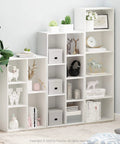 5-Cube Bookshelf Organizer With Reversible Design And Easy Assembly in living room, featuring open storage cubes with decor items.