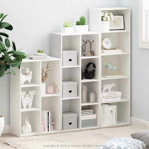 5-Cube Bookshelf Organizer With Reversible Design And Easy Assembly in living room, featuring open storage cubes with decor items.