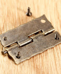 Close-up of 2 Pack Cabinet Door Hinges 36x23mm Wooden Box Decorative Hinges With Screws And Storage Box on wood surface