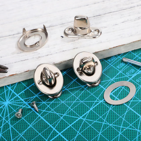 Front view: two silver marine twist-lock fasteners with eyelet studs and mounting screws