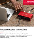 Scarlett Solo Studio 3rd Gen USB Audio Interface connected to a laptop on a desk for recording.