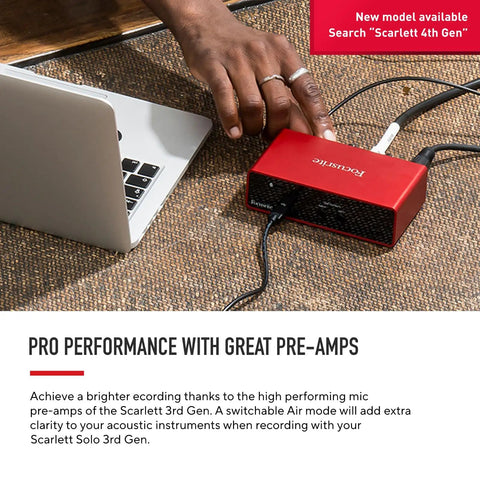 Scarlett Solo Studio 3rd Gen USB Audio Interface connected to a laptop on a desk for recording.