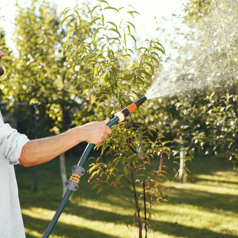 Man using Garden Hose Repair Kit With Zinc And Aluminum Male And Female Fittings Fits 3/4 Inch And 5/8 Inch Hoses Includes Two Sets of Fittings