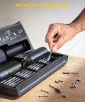 Magnetic storage box with electric screwdriver and bits for laptops, featuring organized slots and screws for precise repairs.