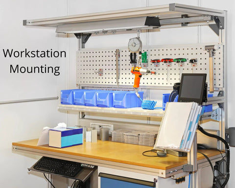 Workstation with tool pegboard, blue storage bins, and mounted tools for convenient access in an organized work environment.